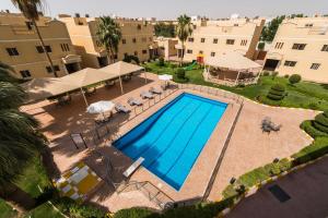 an overhead view of a swimming pool in a courtyard at Boudl Al Malaz in Riyadh