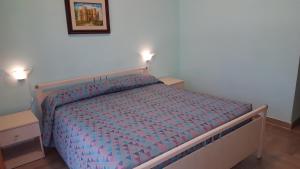 Postel nebo postele na pokoji v ubytování Villa Erry