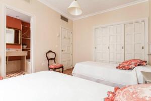 Posteľ alebo postele v izbe v ubytovaní Apartamento Plaza Nueva