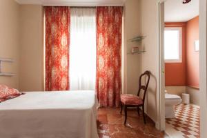 Posteľ alebo postele v izbe v ubytovaní Apartamento Plaza Nueva
