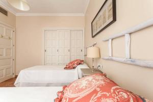 Posteľ alebo postele v izbe v ubytovaní Apartamento Plaza Nueva