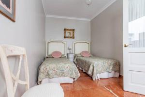 Posteľ alebo postele v izbe v ubytovaní Apartamento Plaza Nueva