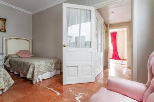 Posteľ alebo postele v izbe v ubytovaní Apartamento Plaza Nueva