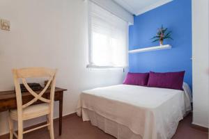 Posteľ alebo postele v izbe v ubytovaní Apartamento Plaza Nueva