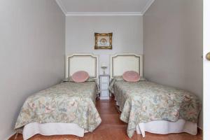 Posteľ alebo postele v izbe v ubytovaní Apartamento Plaza Nueva
