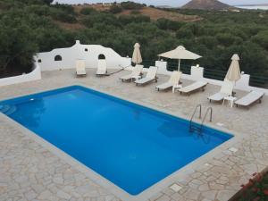 The swimming pool at or close to Cavo Plako Villas