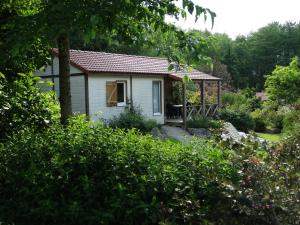a cottage in the garden with a gazebo at Chalets du pontot in Le Fay +19 photos