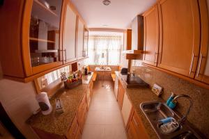 an overhead view of a kitchen with wooden cabinets at Just Estoril in Estoril