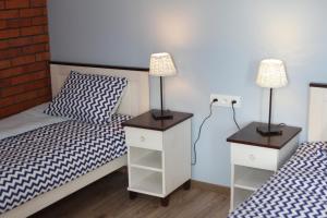 Postel nebo postele na pokoji v ubytování Dom Mierzeja