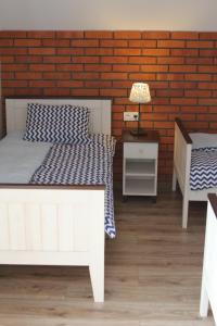 Postel nebo postele na pokoji v ubytování Dom Mierzeja