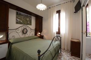Postel nebo postele na pokoji v ubytování Il Paradiso Di Hyele
