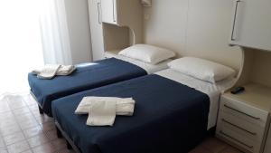 Postel nebo postele na pokoji v ubytování B&B - Meuble' - Hotel " CORDIALE "