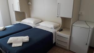 Postel nebo postele na pokoji v ubytování B&B - Meuble' - Hotel " CORDIALE "