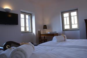 Cama ou camas em um quarto em Quinta Paços do Lago
