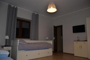 Postel nebo postele na pokoji v ubytování Dom Mierzeja