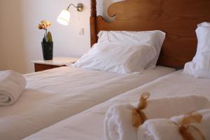 Cama ou camas em um quarto em Quinta Paços do Lago