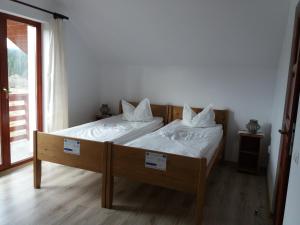 Ein Bett oder Betten in einem Zimmer der Unterkunft Pensiunea Agroturistica Alexandra