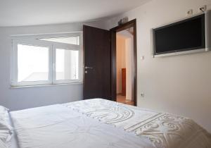 Una cama o camas en una habitación de Apartment Sirius