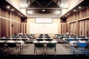 a room with tables and chairs and a projection screen at Flora Creek Chiang Mai in Hang Dong +57 photos