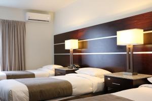Ένα ή περισσότερα κρεβάτια σε δωμάτιο στο Airport Gateway Hotel