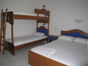 Postel nebo postele na pokoji v ubytování Camping Tsitreli