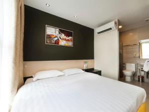Postel nebo postele na pokoji v ubytování One Avenue Hotel