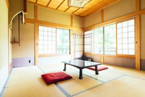 Postel nebo postele na pokoji v ubytování 高野山 宿坊 増福院 -Koyasan Shukubo Zofukuin- + 33 fotografií