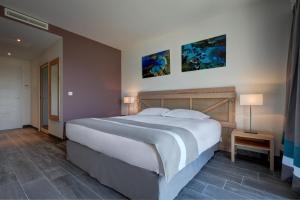 Postel nebo postele na pokoji v ubytování Hotel Carre Noir