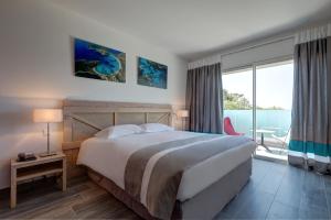 Postel nebo postele na pokoji v ubytování Hotel Carre Noir