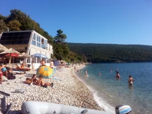 a group of people on a beach in the water at Villa Nostra - Kruče in Ulcinj