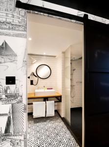 a bathroom with a shower and a sink at Pentahotel Hong Kong, Tuen Mun in Hong Kong