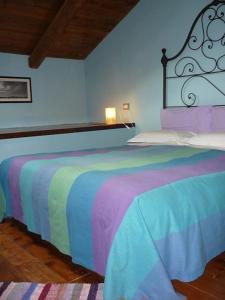 A bed or beds in a room at Cascina Sant'Eufemia