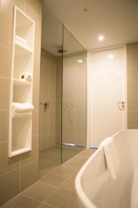 Een badkamer bij Hotel Katoen
