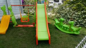 a group of playground equipment on the grass at Fethiye Pension in Fethiye