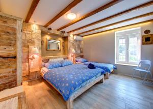 Giường trong phòng chung tại Apartments Villa Mike