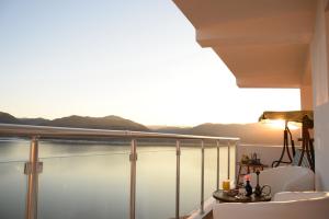 a balcony with a view of a body of water at Lakeview-Estate ApartHotel in Staro Myasto