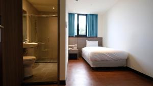 Łóżko lub łóżka w pokoju w obiekcie CHIILIH HOTEL- Su ao