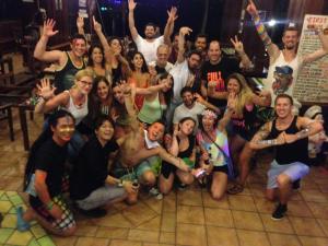 a group of people are posing for a picture at First Villa Beach Resort in Ban Tai