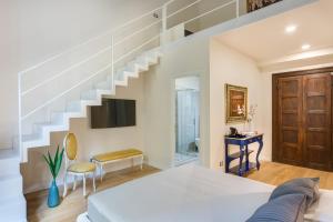 A bed or beds in a room at Residenza D'Epoca Historia Luxury Boutique