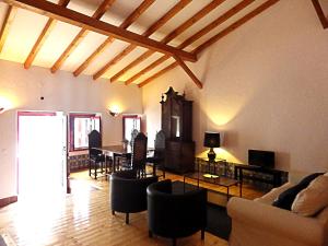a living room with a couch and a table at Casa de Nossa Senhora da Conceição in Gavião