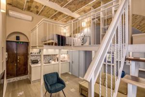 a room with a loft bed and a staircase at Domus Urbana in Rome