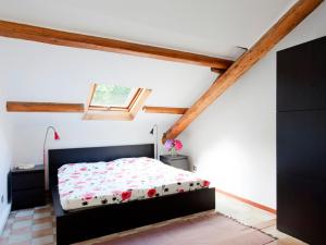 a bedroom with a bed in a attic at Il Poggio Como in Brunate