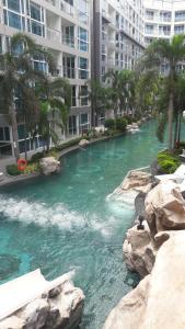 a river in the middle of a city with buildings at Central Pattaya Apartments in Pattaya