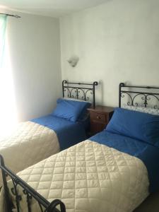 Postel nebo postele na pokoji v ubytování Agriturismo La Ferriera