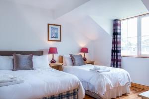 
A bed or beds in a room at Killarney's Holiday Village
