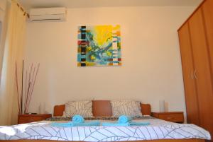 Postel nebo postele na pokoji v ubytování Apartments & Studio Matan