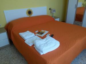 En eller flere senge i et værelse på A1 Girasole B&B