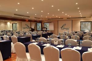 a set up for a banquet in a room with tables and chairs at Capitol Hotel Jumeirah Dubai in Dubai