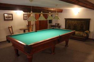 a room with a pool table and a couch at Hotel Rytířsko in Jamné