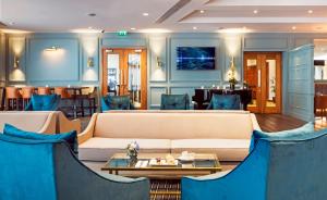 a living room with a couch and a table at CityNorth Hotel & Conference Centre in Gormanston